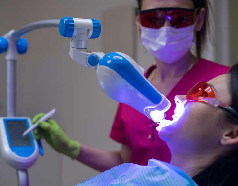 Female patient receiving laser dental treatment at a dental clinic in Stafford, VA