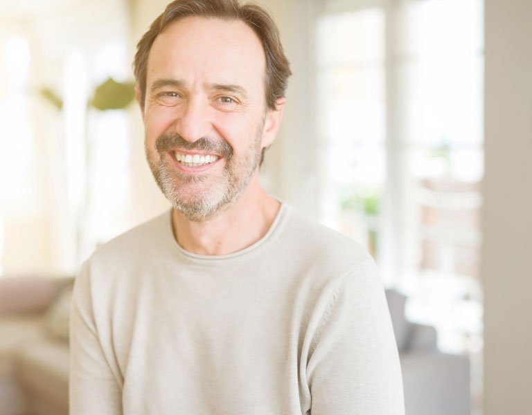 Middle-aged man smiling confidently in Stafford, VA