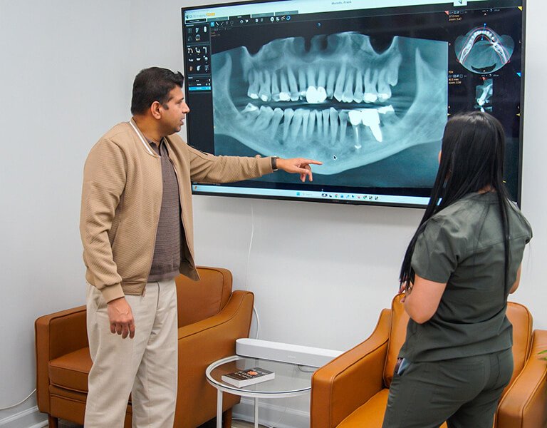 Dr. Sachin Karande checking a dental X-Ray